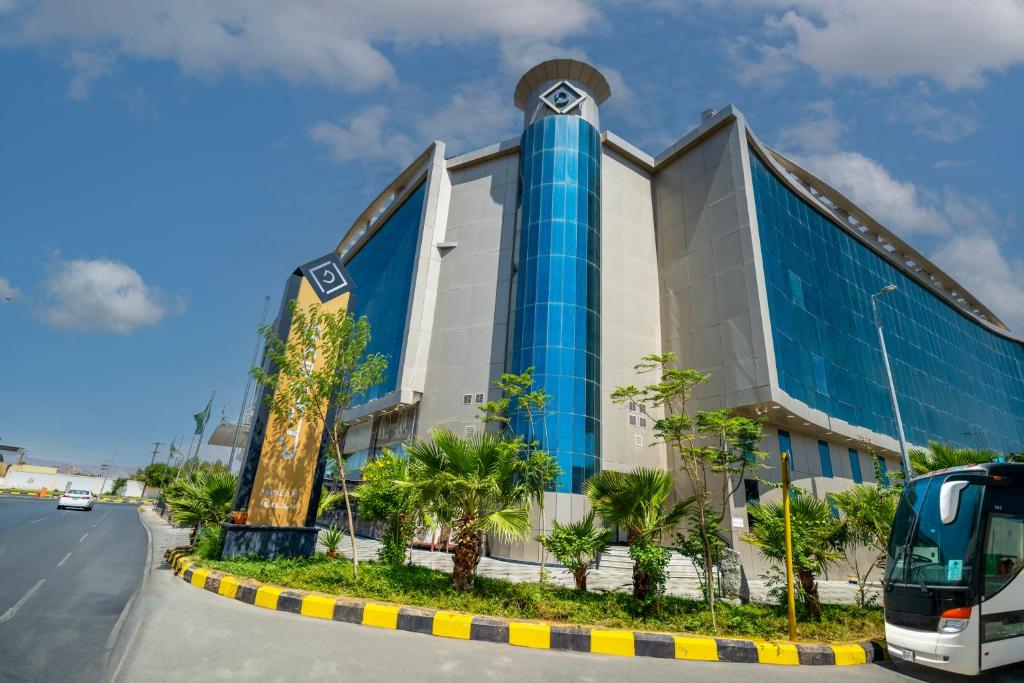 a building on the side of a road at The District Hotel Najran in Najran