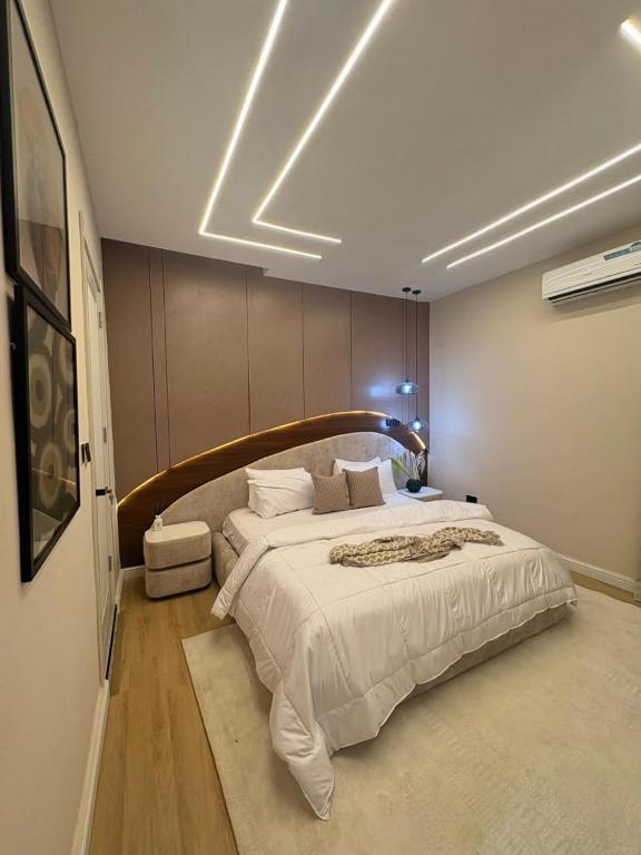 a bedroom with a large bed in a room at TC luxury home in Lekki