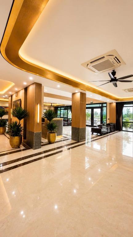a lobby with a ceiling with plants in it at A30 Hotel & Apartment in Lưu Xá