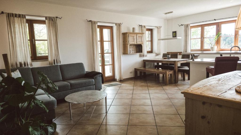 a living room with a couch and a table at Luna Mia Apartment 2 in Schwangau