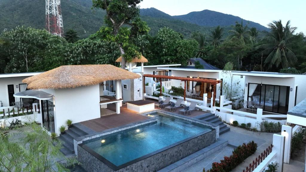 an image of a house with a swimming pool at Pukawa Hotel & Residence in Chaloklum
