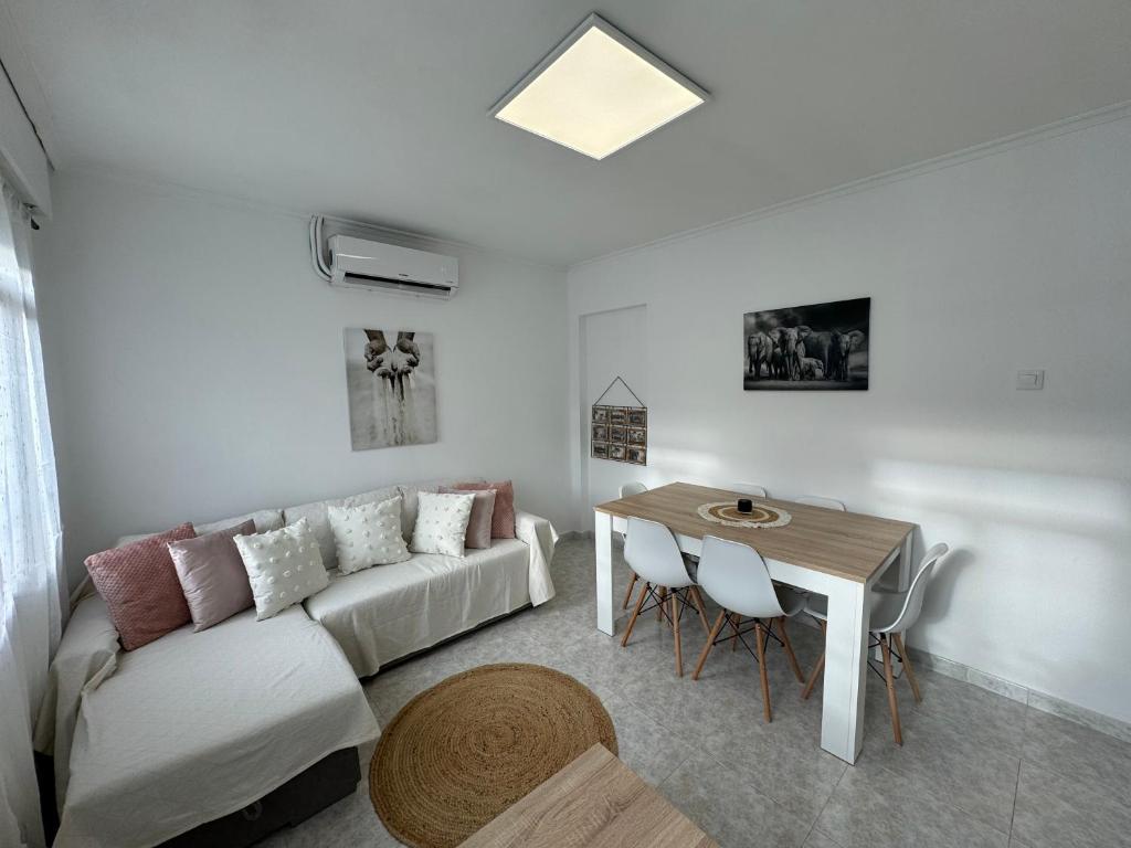 a living room with a couch and a table at SotQui Cedeira in Cedeira