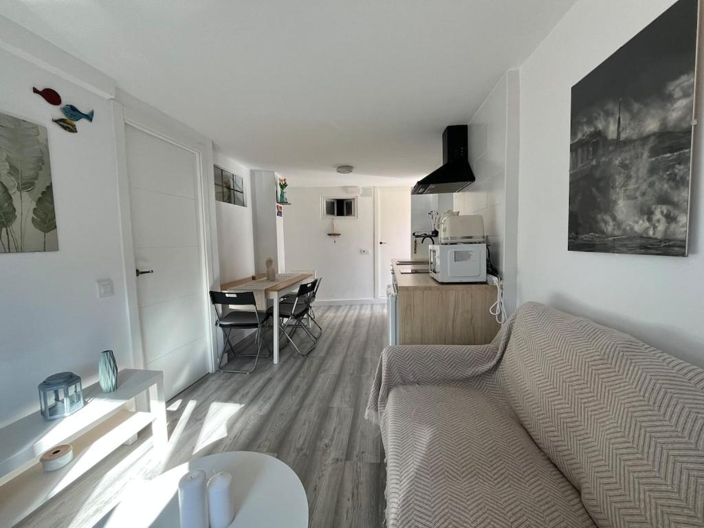 a living room with a couch and a table at R2R - Casa Gatu - 307A in Cudillero