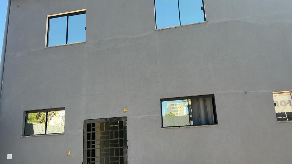 a building with four windows on the side of it at Center in Uberlândia