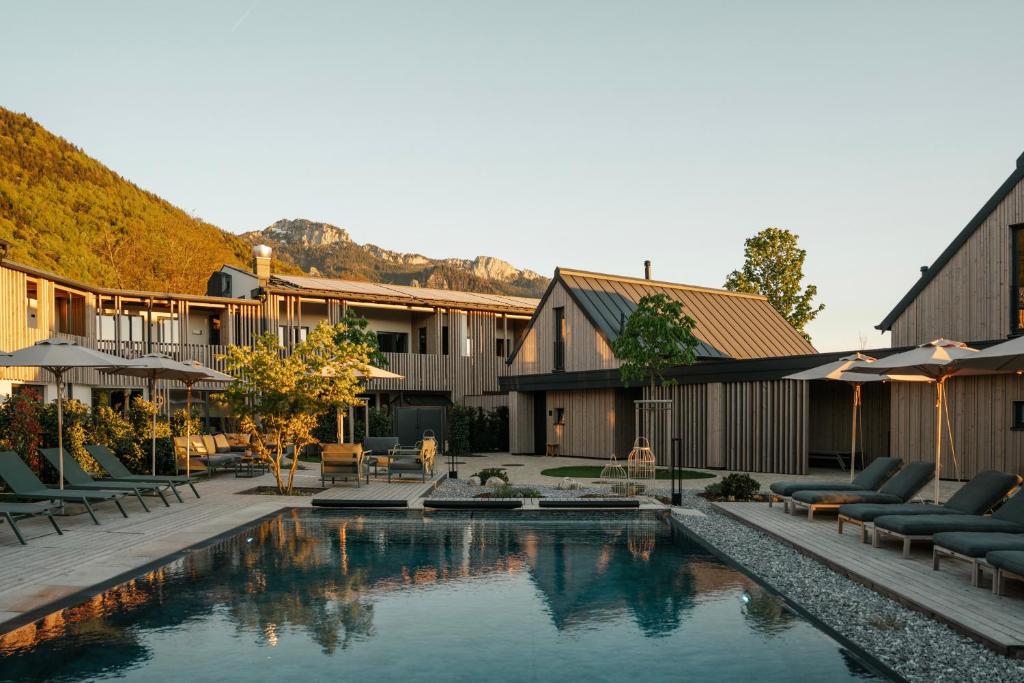 a courtyard with a swimming pool in a house at Agrad Chalets in Aschau im Chiemgau