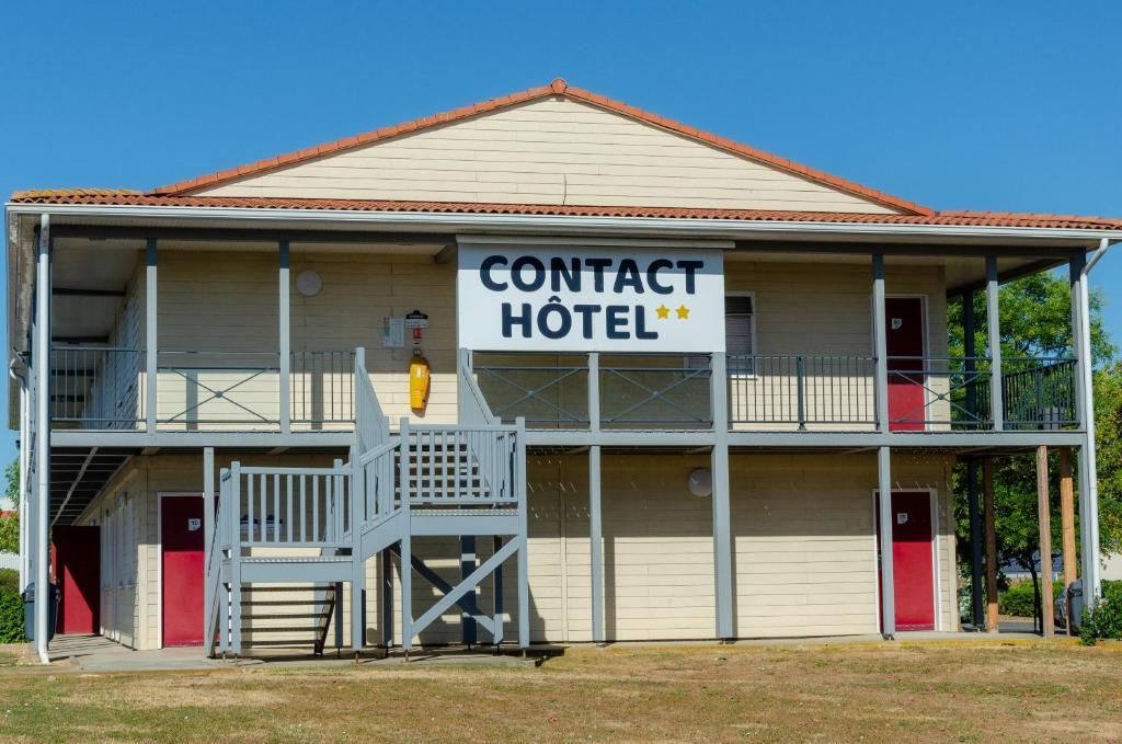 a building with a sign that reads contact hotel at Contact Hôtel Fontenay le Comte in Fontenay-le-Comte