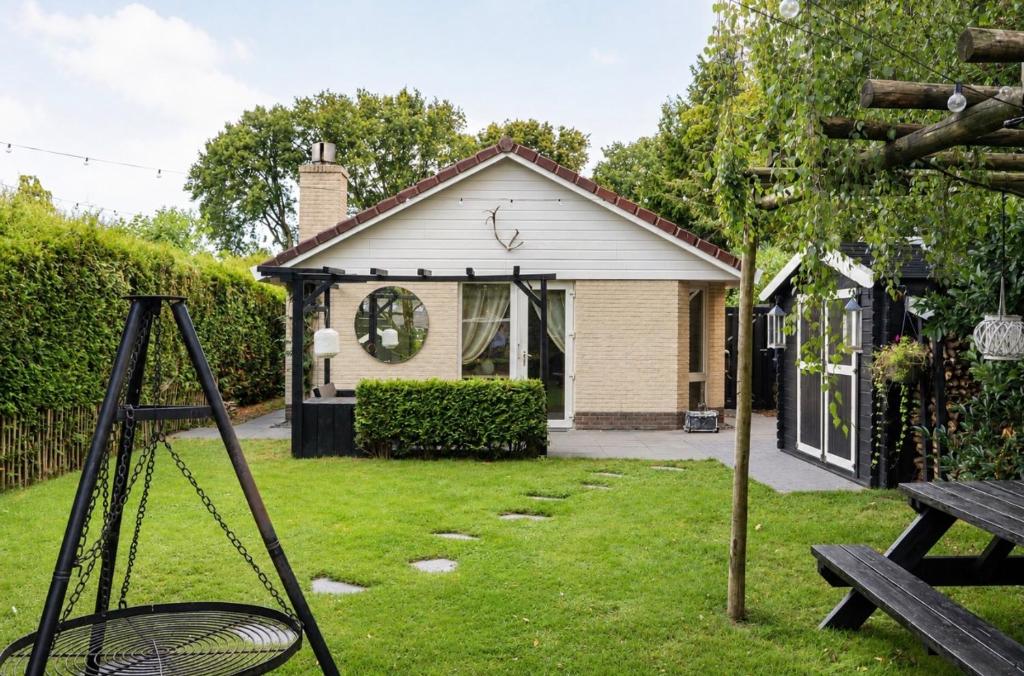 a house with a basketball hoop in the yard at Weidezicht in Ermelo