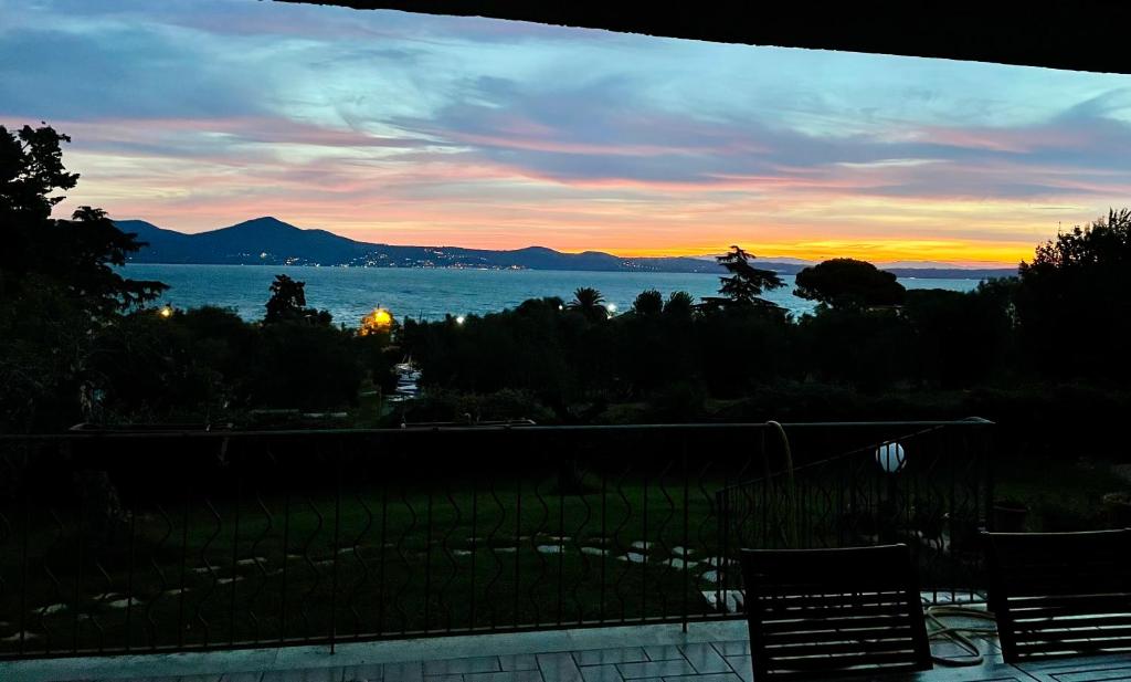 a view of the ocean at sunset from a house at Villa Bel Lago in Bracciano