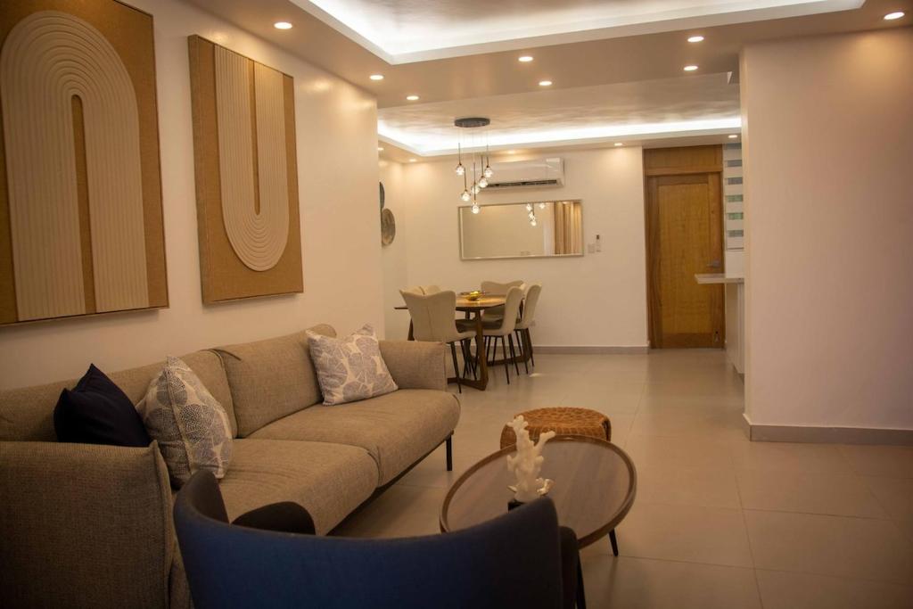 a living room with a couch and a table at Condo in Puerto Plata in San Felipe de Puerto Plata