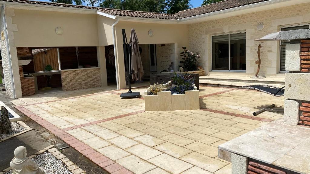 a patio of a house with a patio at Maison Thierry in Pierre Penot