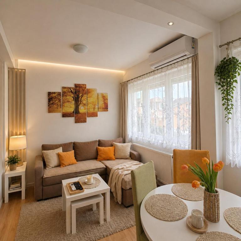 a living room with a couch and a table at Garden lux 1 in Belgrade
