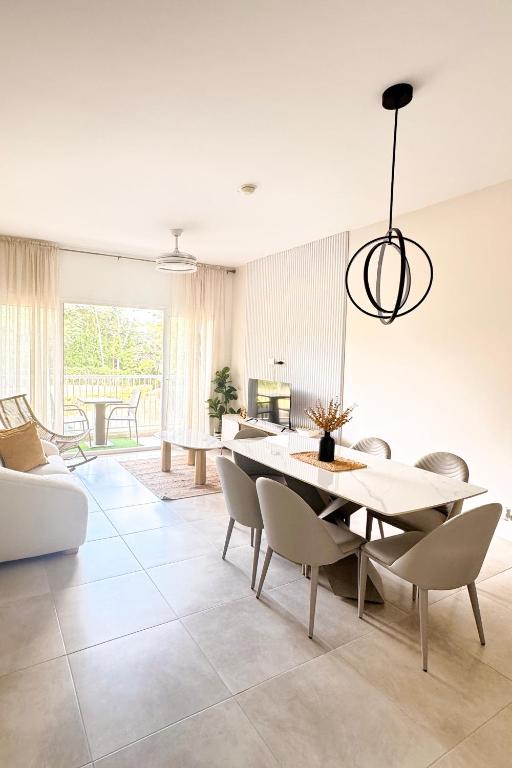 a living room with a dining table and chairs at PH Palash Tower in Rousseau