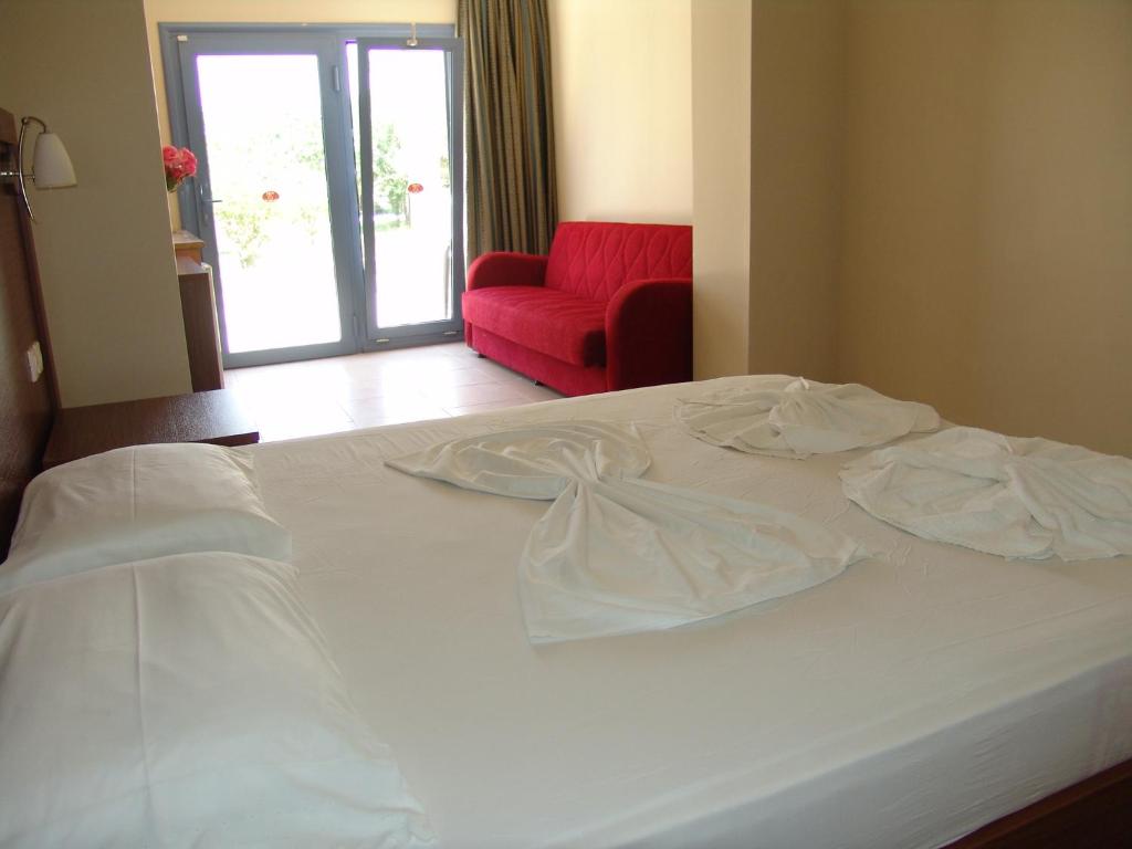 Postel nebo postele na pokoji v ubytování Hermes Hotel