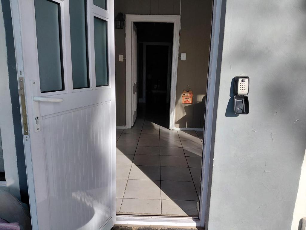 a door leading to a hallway with aoyer with aoyer at Ocean River no 1 in Gqeberha