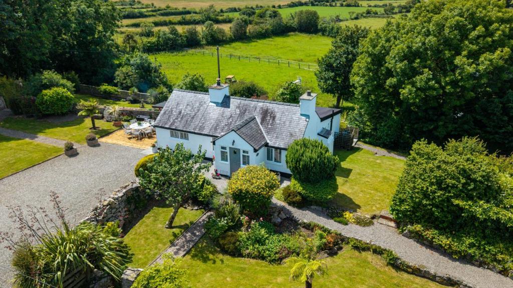 an aerial view of a house with a garden at Penrallt in Benllech