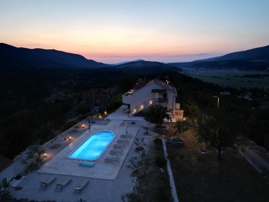 an aerial view of a villa with a swimming pool at Villa Brig in Ramljane
