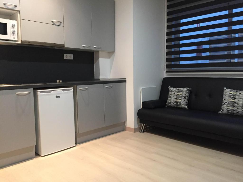 Kuchyň nebo kuchyňský kout v ubytování Apartahotel Baldiri