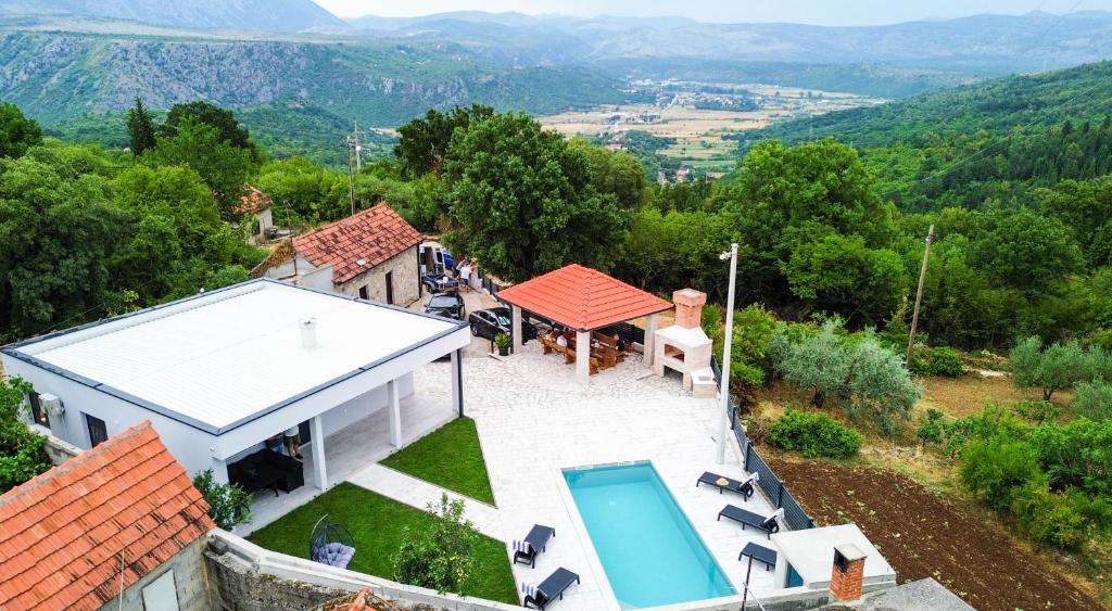 an aerial view of a house with a swimming pool at Villa Dub in Stolac