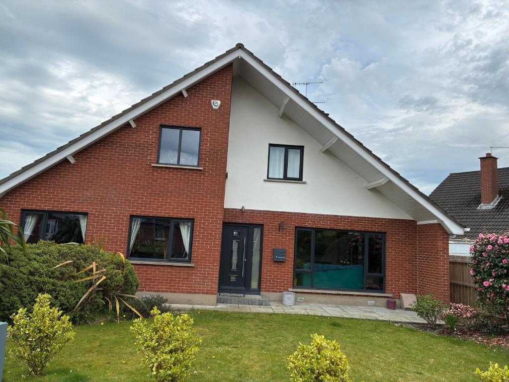 a house with a red brick at Loughshore, Large Detached House, Jordanstown in Newtownabbey