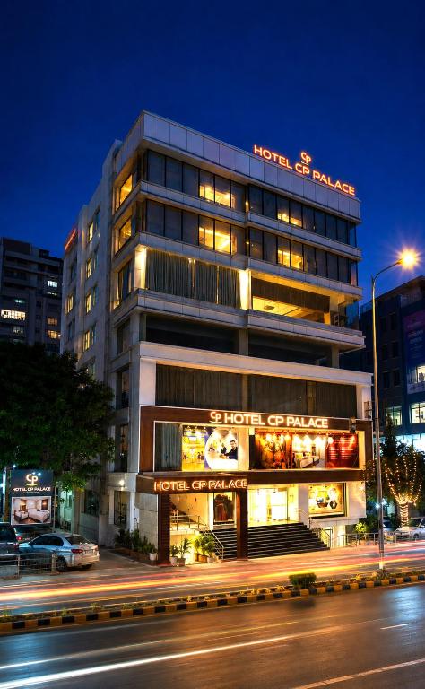 a building with a sign on top of it at Hotel CP Palace in Patna