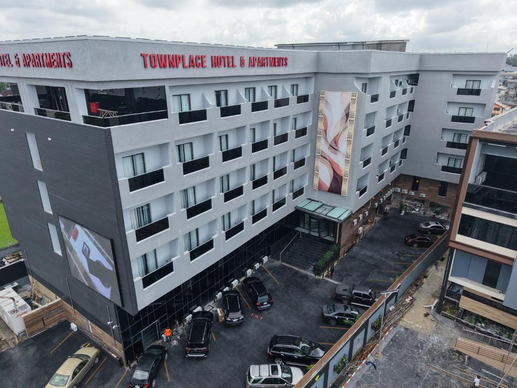 an aerial view of a building with a parking lot at Townplace Hotel & Apartments in Port Harcourt