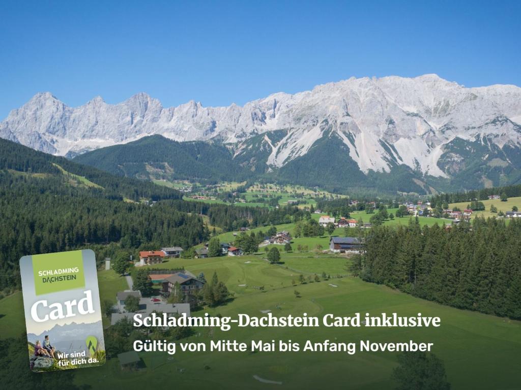 a sign for the saltishing dachstein car institute with a mountain at Kobaldhof in Ramsau am Dachstein