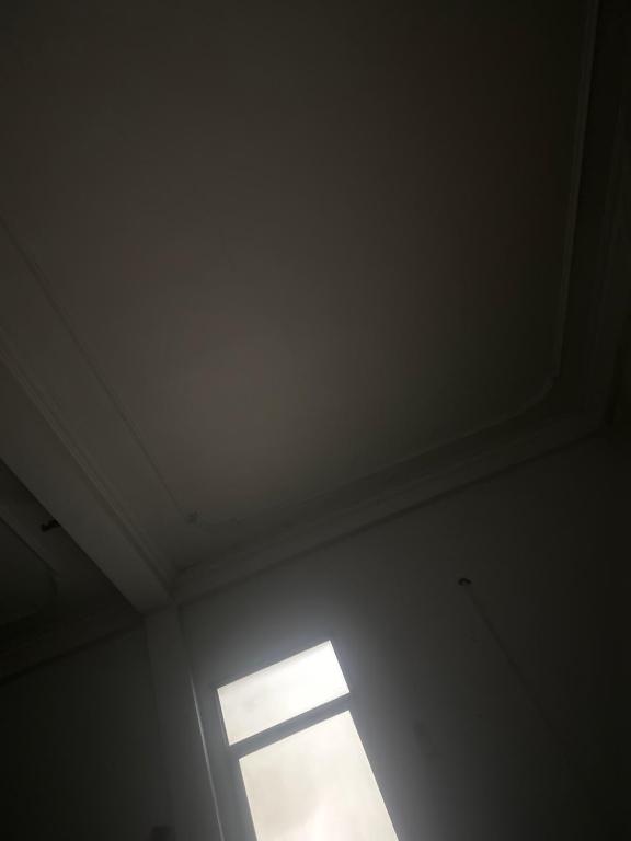 a window in a room with a white ceiling at Dubai in Thuong Thon