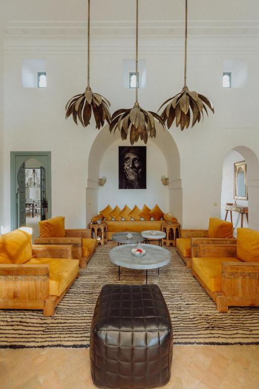 a large living room with couches and a table at Villa Marrakech Beldi in Najem