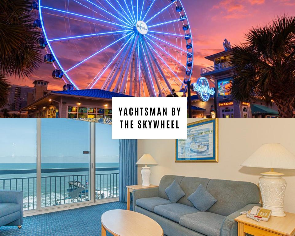 a living room with a couch and a ferris wheel at Oceanfront 1BR by Skywheel Yachtsman 701 in Myrtle Beach