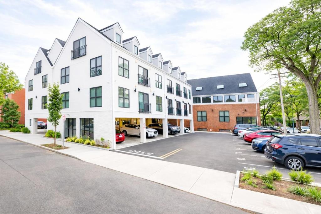 an apartment building with a parking lot at Modern Yale Loft Best Location Parking in New Haven