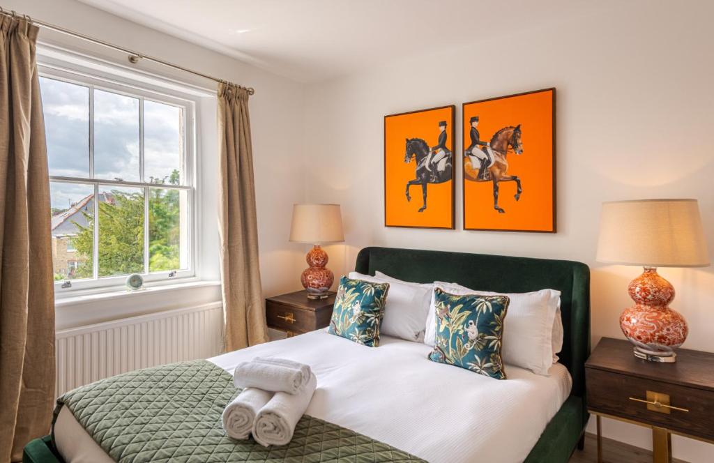 a bedroom with a bed and a window at Chic 1BR Teddington Apartment Modern & Bright in Kingston upon Thames