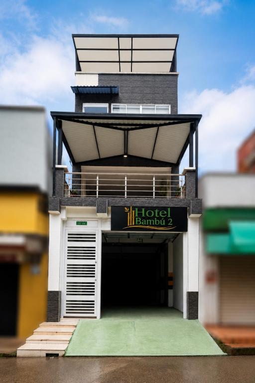 a model of a hotel building with a garage at Hotel Bambù 2 in Puerto Asís