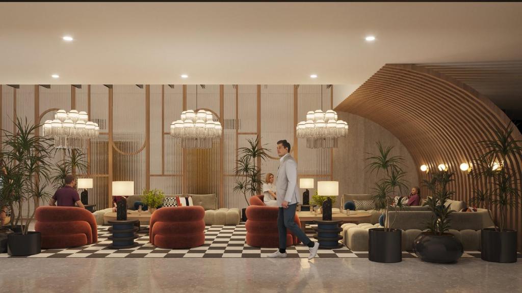 a man standing in the lobby of a hotel at Hotel Indigo Tijuana Downtown by IHG in Tijuana