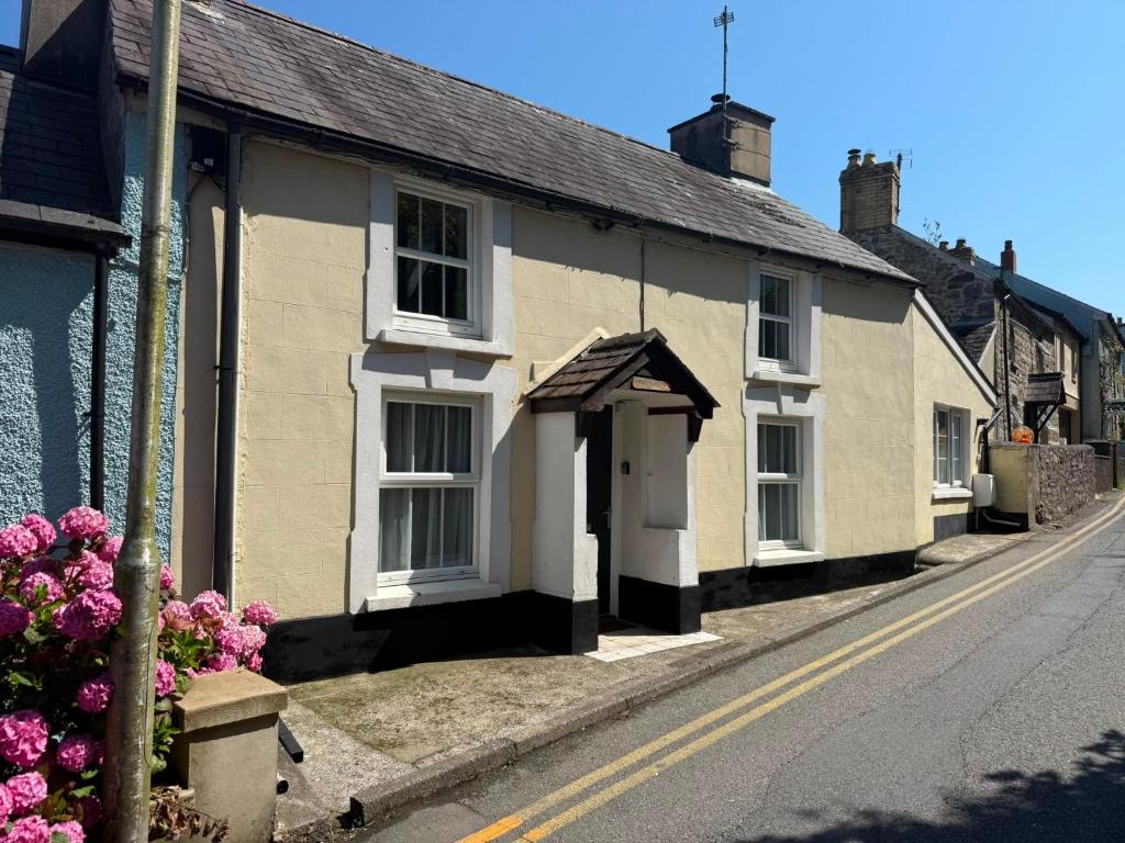 a row of houses on the side of a street at Bryndegwel in Saint Dogmaels, cardigan- river views, Free parking in Cardigan