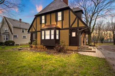 a house with a black and yellow house at Rochester Gem: 3BR Near All! in Rochester
