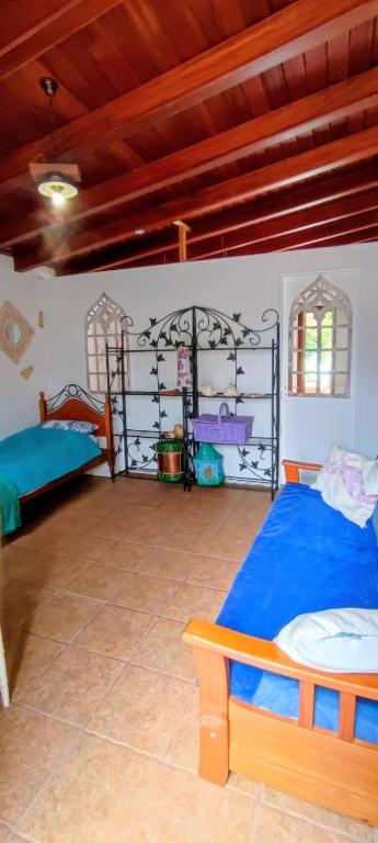 a bedroom with two beds and a bunk bed at Middle Earth in El Paso