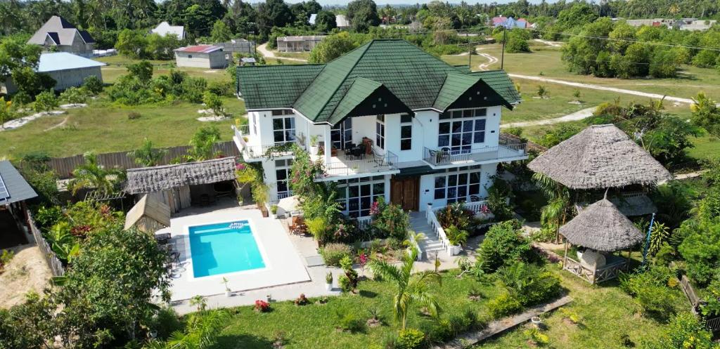 an aerial view of a house with a swimming pool at Maneri Villa and Apartments in Zanzibar City