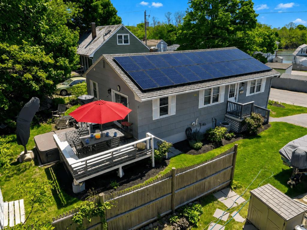 a house with solar panels on the roof at Ryal Side Hideaway Cove in Beverly