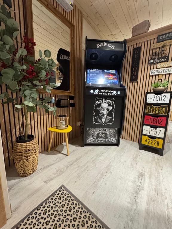 a room with a video game machine in a room at Le Refuge in Margencel