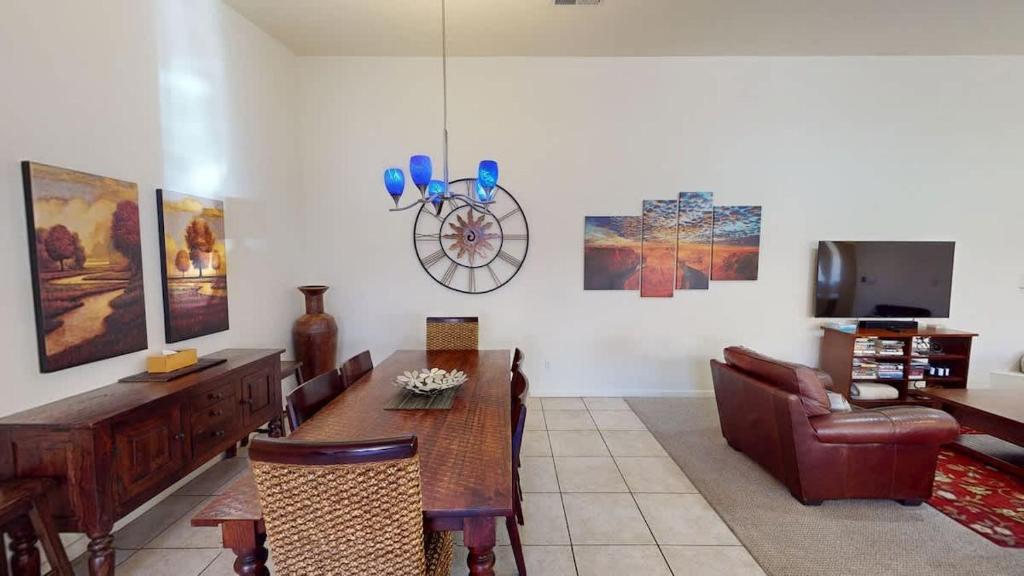 a living room with a table and a couch at Leisure Space #327 in Moab