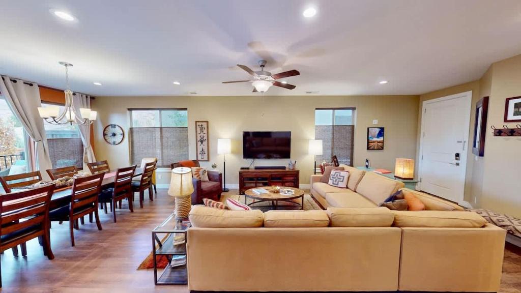 a living room with a couch and a dining room at Entrada at Moab #640 in Moab