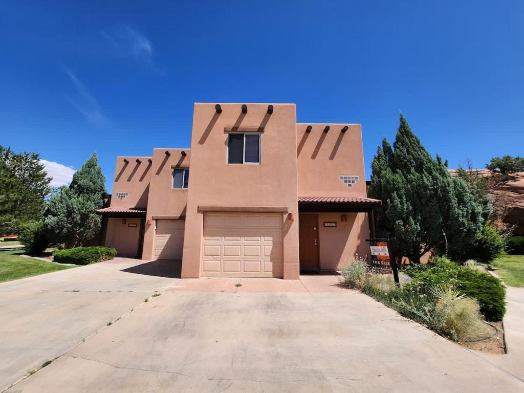 a large house with a garage in a driveway at The Rock #3461 in Moab