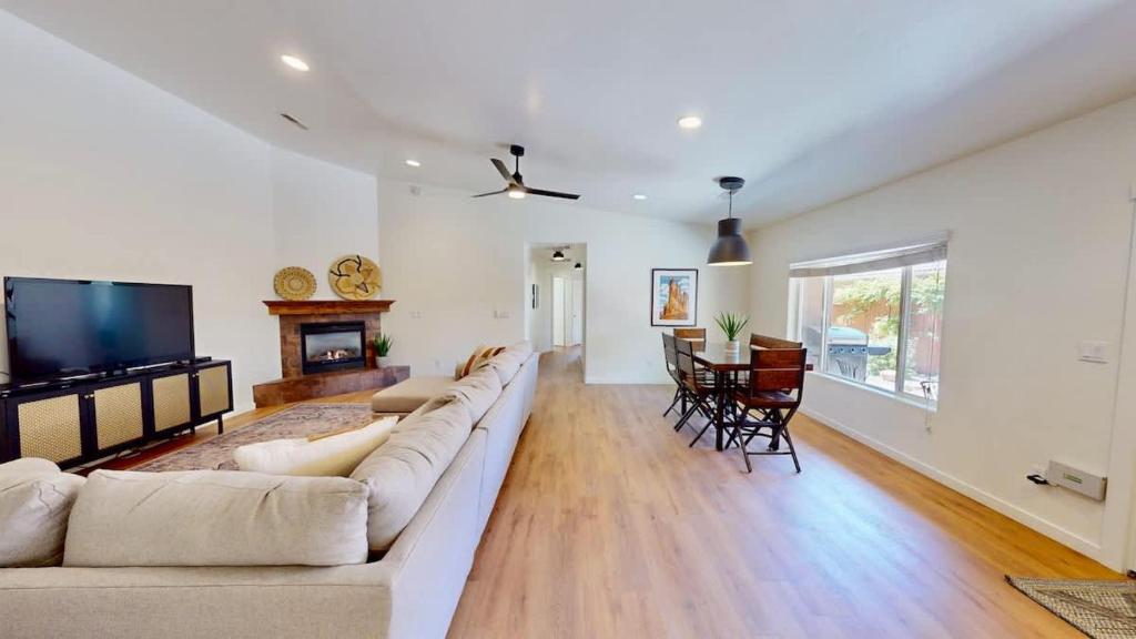 a living room with a large couch and a television at Portal Vista #443 in Moab