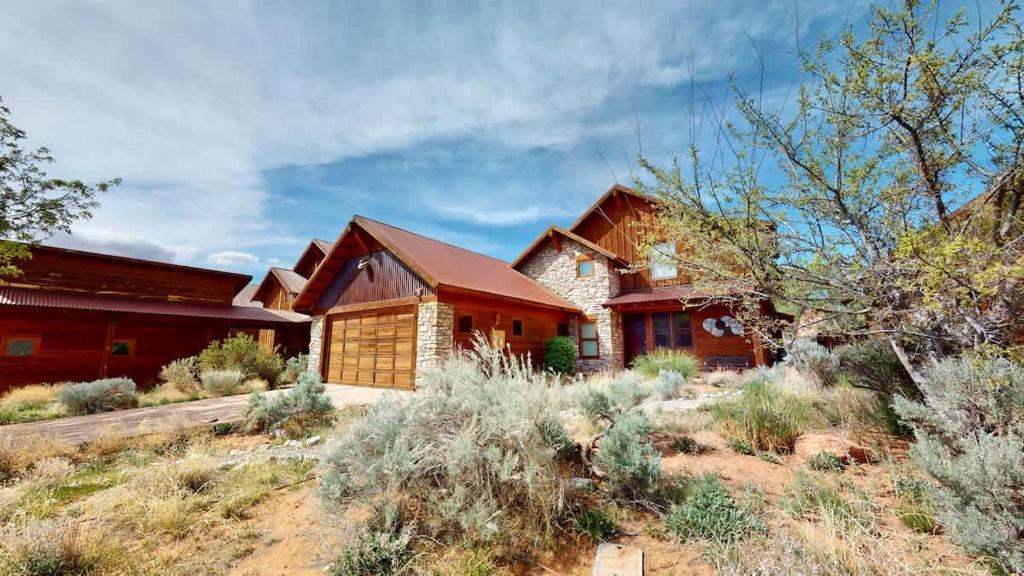 a house in the middle of a field at Coyote Run #4 in Moab