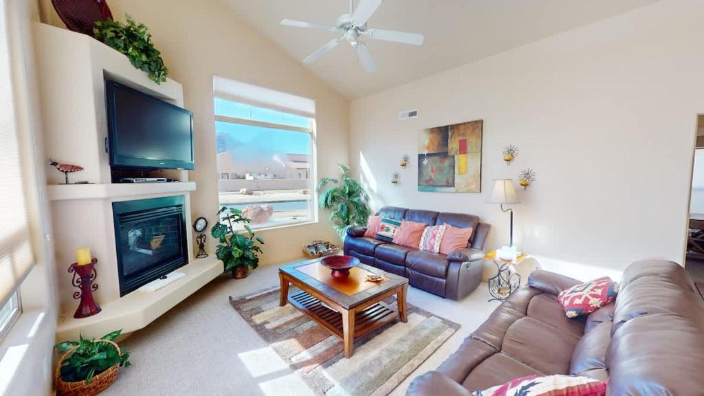 a living room with a couch and a tv at Jan's Joy #N3 in Moab