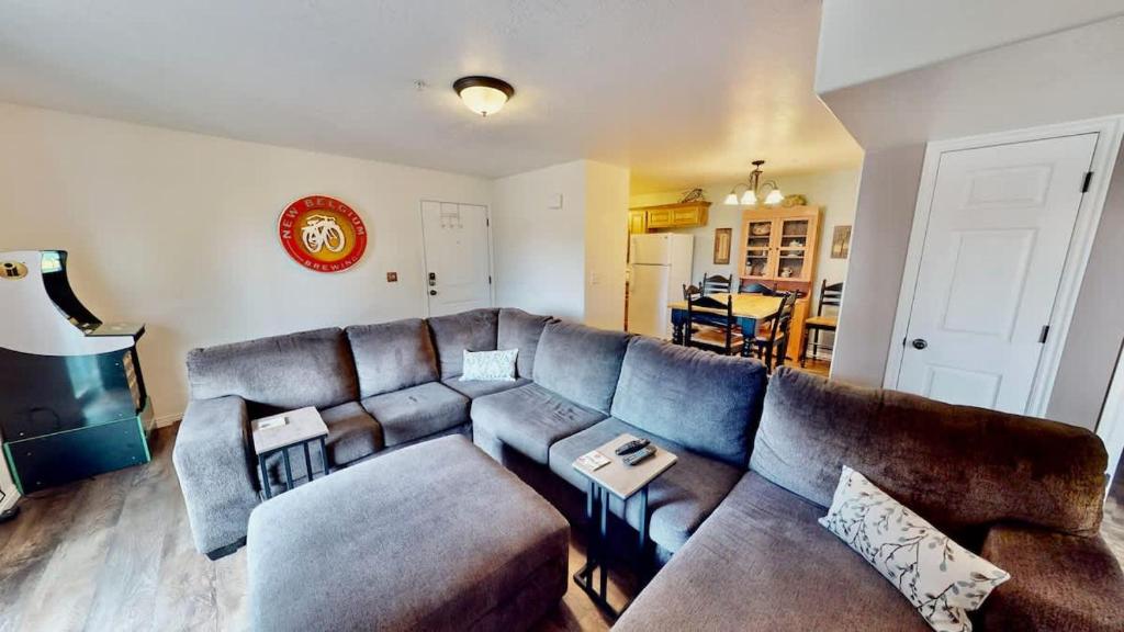 a living room with a couch and a table at Red Cliff Condos #1H in Moab
