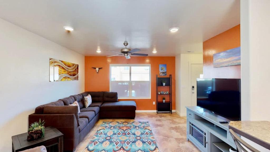 a living room with a couch and a tv at Slick Rock Reserve #12A3 in Moab