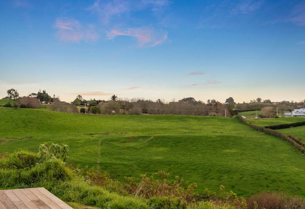 a field of green grass with a blue sky at 1 Bedroom Granny Flat D in Runciman