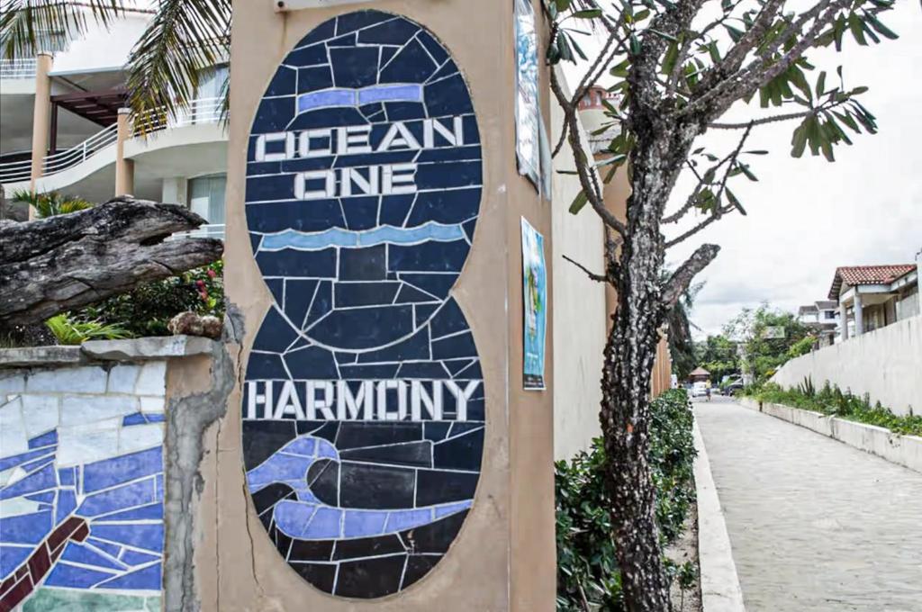 a surfboard painted on the side of a building at Ocean One - Harmony! in Cabarete