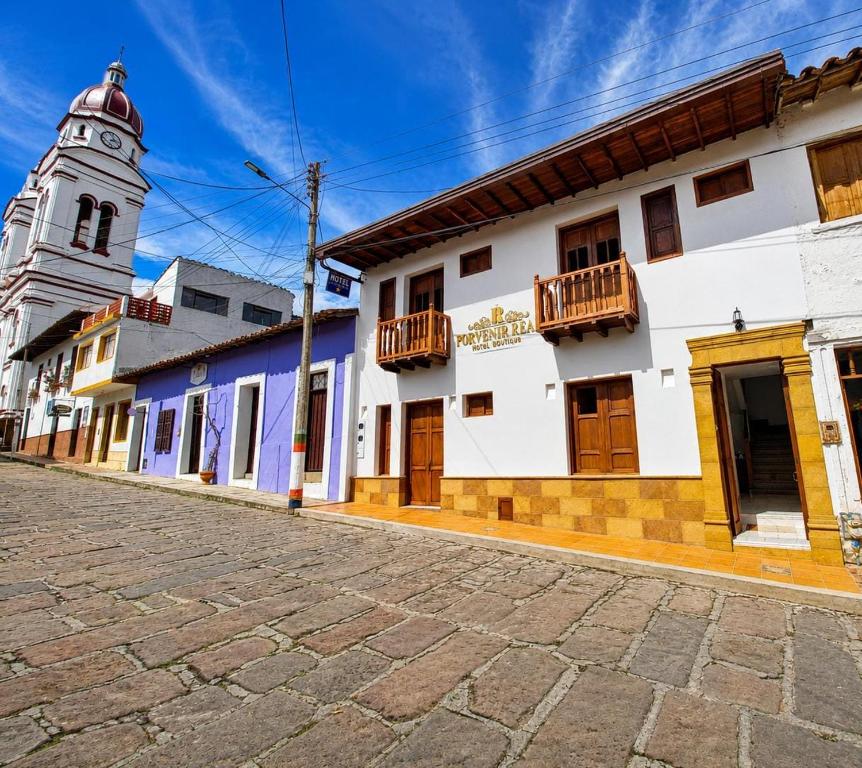 a street in a town with a clock tower at Hotel Boutique Porvenir Real in Charalá